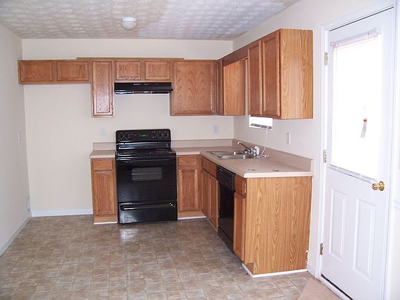 Open Kitchen with Black Appliances!