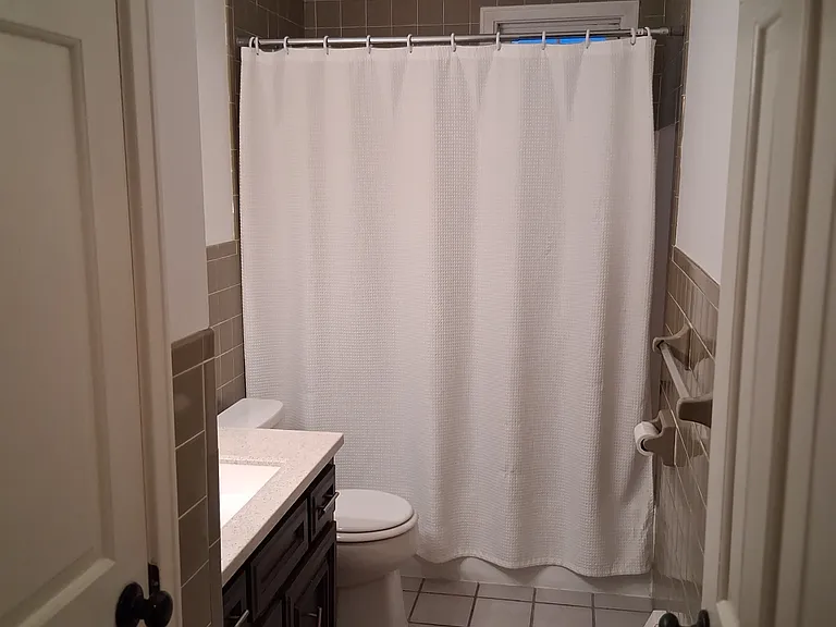 Large bathroom with shower and linen closet