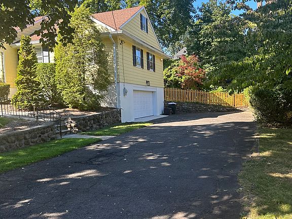 3RD VIEW OF HOUSE. NEWER GARAGE DOORS & FENCE!
