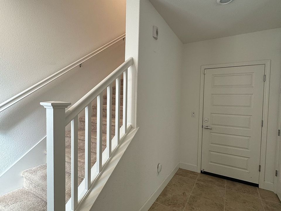 Door to garage and stair to upstairs once enter front door