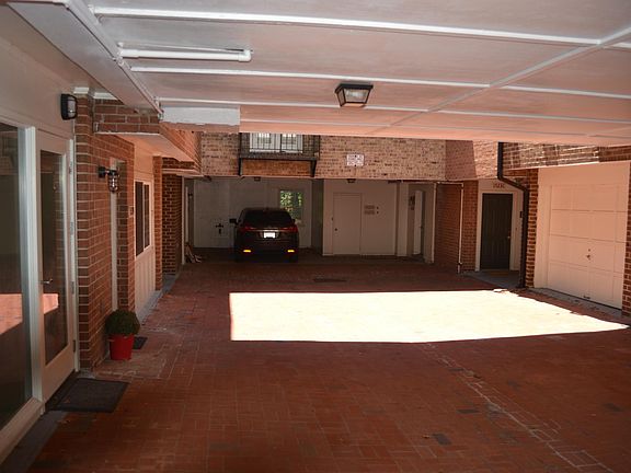Court yard and view of front door on the right.