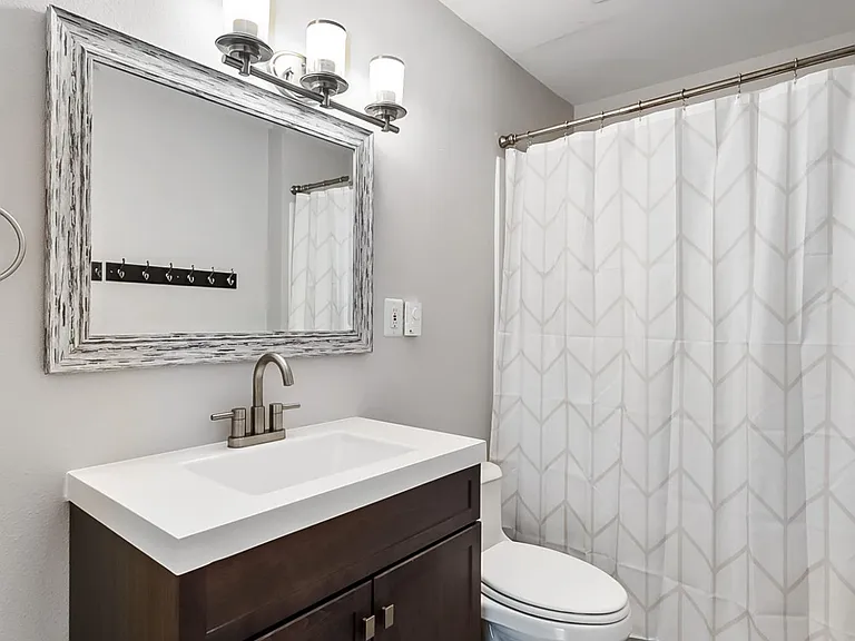 Lower Level Full Bathroom with tile floors.