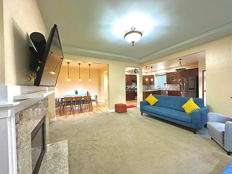 Open layout with kitchen, dining and living