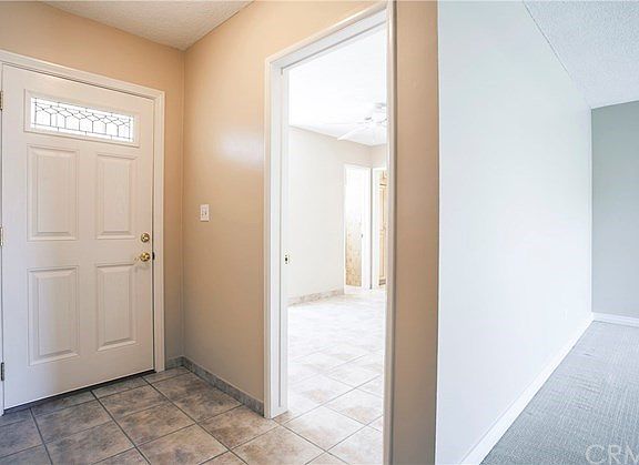 Formal entry with tile flooring