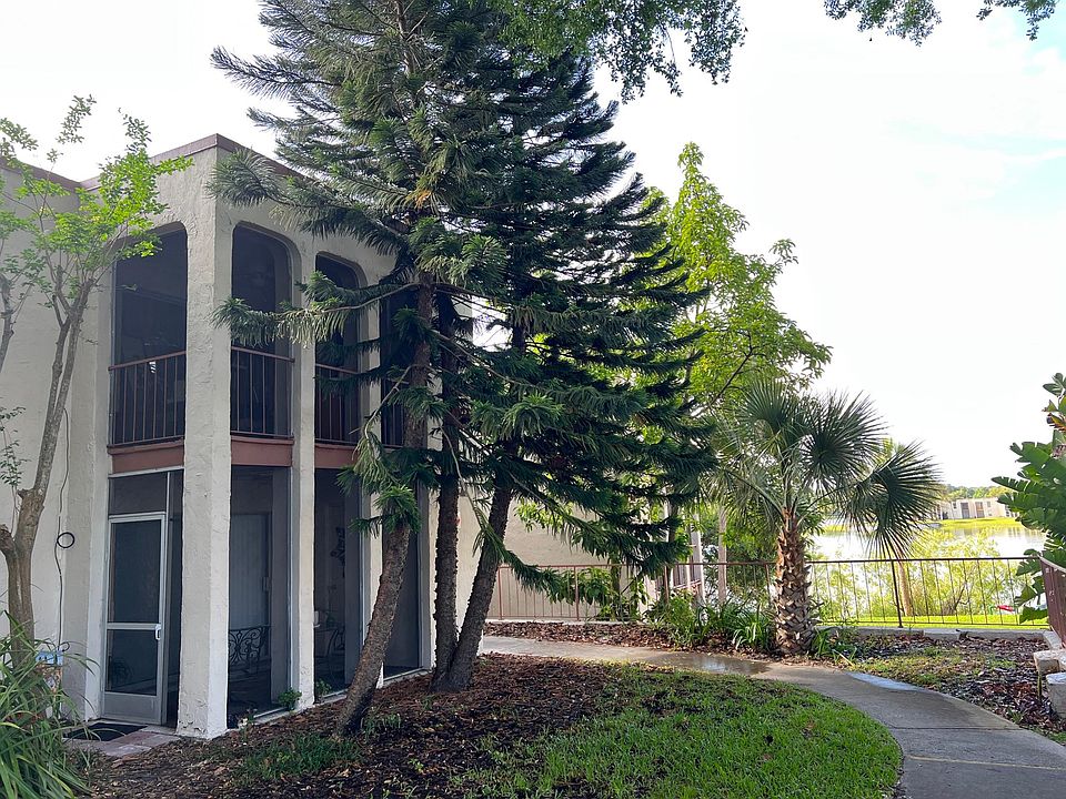 Front view of property ~ First Floor unit with screened in porch!