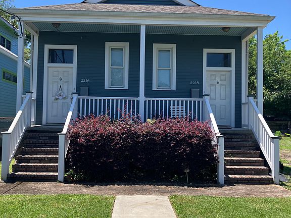 Pretty blue house with brick steps