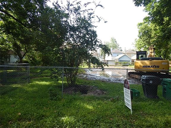 Front fence line. There is an inset gate on the west side of property.