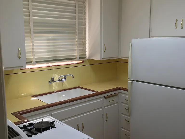 Kitchen with well cared for Wedgewood gas stove
