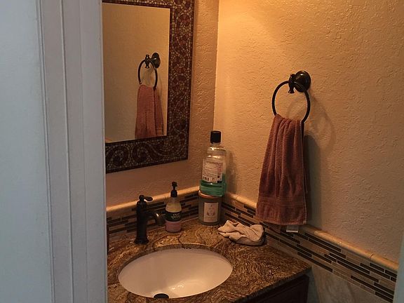 Downstairs bathroom, 1/2 bath with sink and toilet.