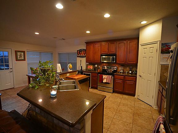 Kitchen includes a large separate breakfast nook and options for island entertaining, too.