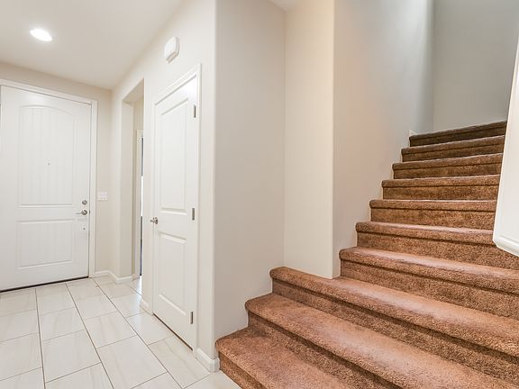 Hallway from Front Door, Stairs Leading up to Bedrooms and Loft.