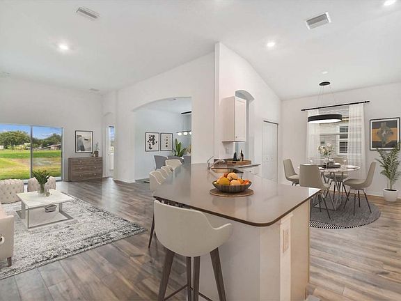 Sweetwater new construction home plan interior open concept family room and kitchen area at Lanier A