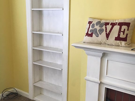 Living Room...Fireplace and bookcase...
