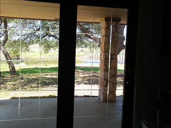 Double doors off dining room to back yard.