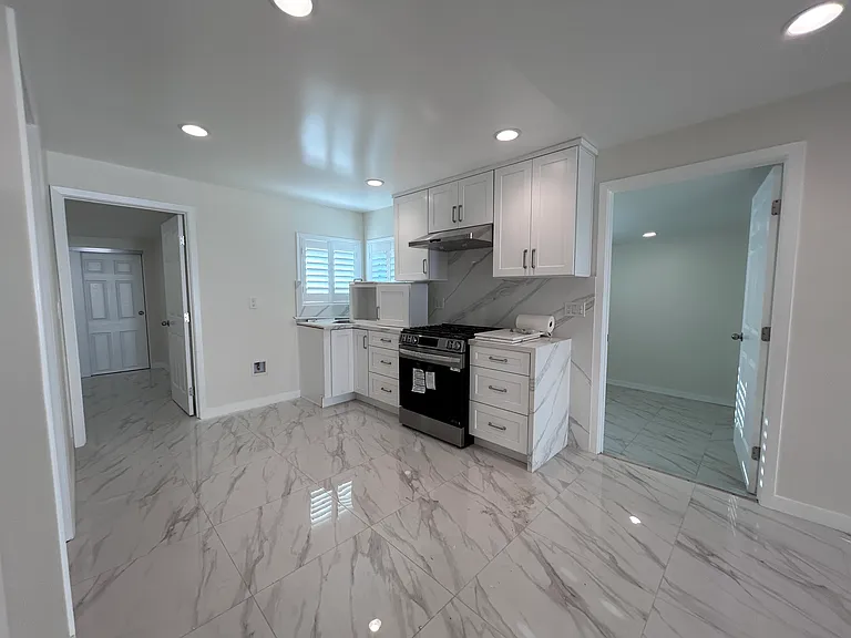 Bedroom 3 (left), kitchen (center), wash room (right)