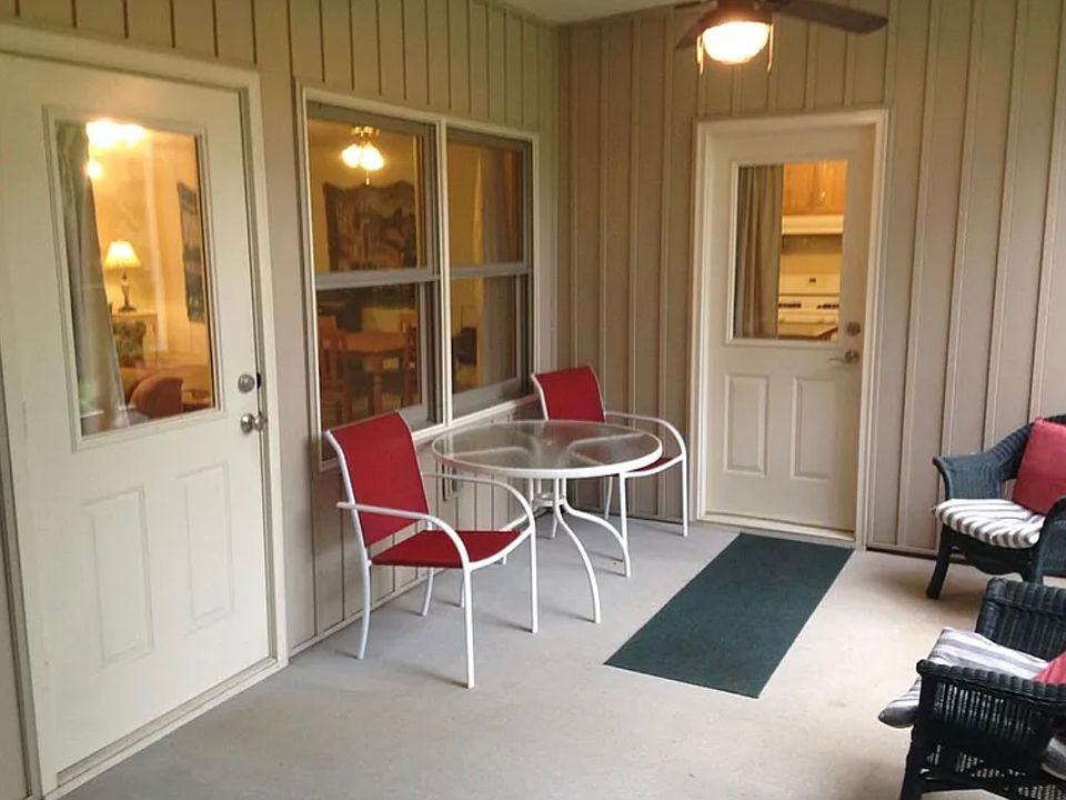 Screened Porch - one door to living area and the other door to kitchen.