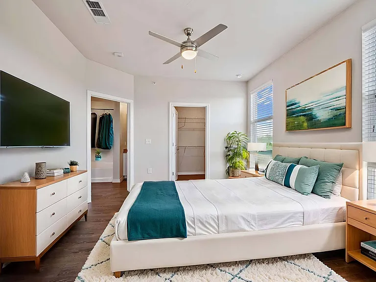 Rest easy in a peaceful bedroom designed for comfort and relaxation.