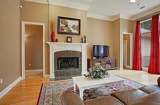 Cozy fireplace with granite tile facing.