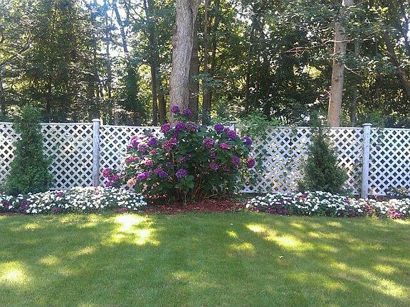 Front side, next to wooded corner lot