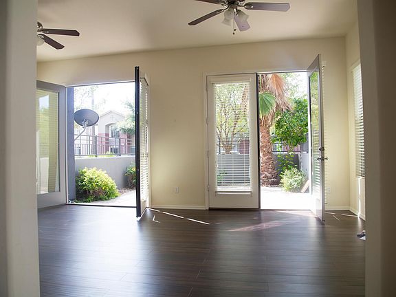 Two big french doors open to the private 400 sq ft paved maintenance free backyard...