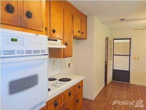 Kitchen looking toward carport.