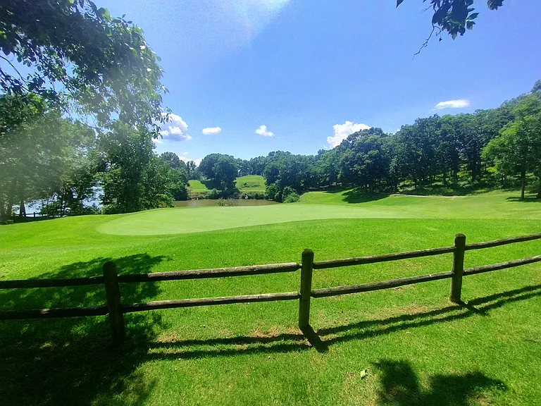 Golf green next to firepit area