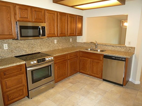 Upgraded Kitchen with Granite Counters, Stainless appliances and Travertine tile floor
