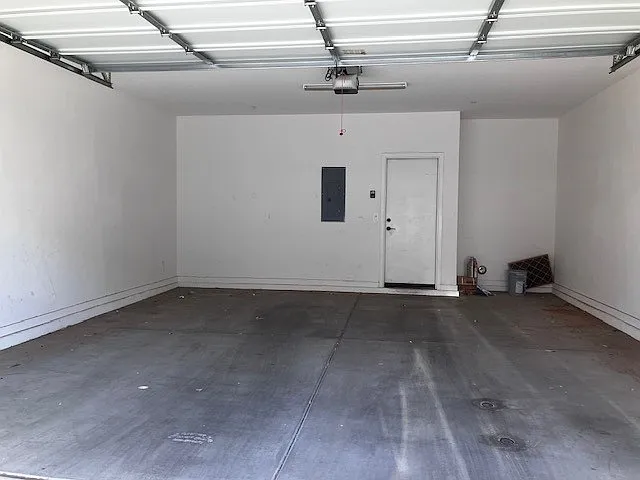 Two car garage with tankless water heater.