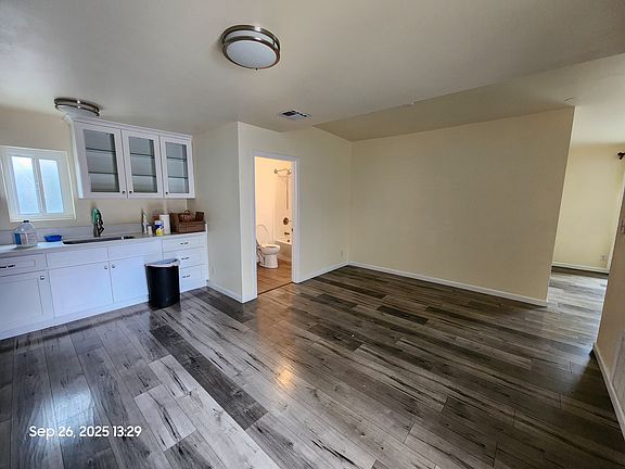 Spacious open layout. Entrance leading to the kitchen and dining area.