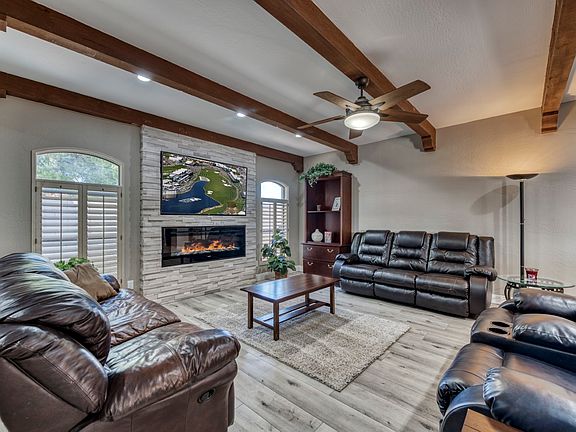 Family room with fireplace, TV and plenty of comfortable seating