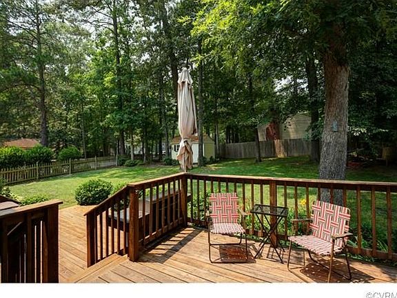 Large fenced yard with attached and detached sheds