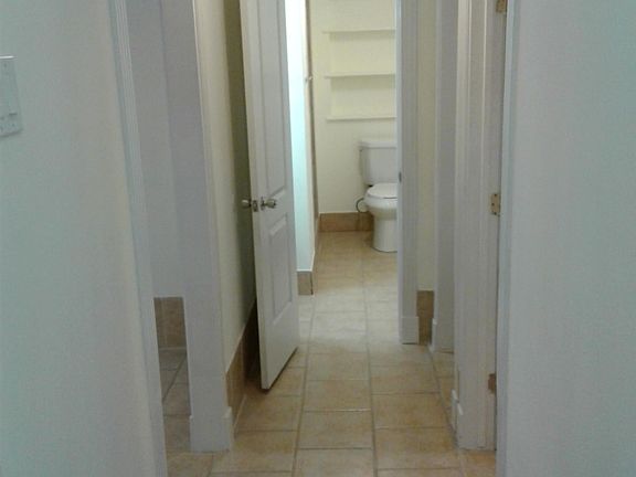 Hallway from inside front door. Once inside, there are 2 steps down in hallway going towards bath.