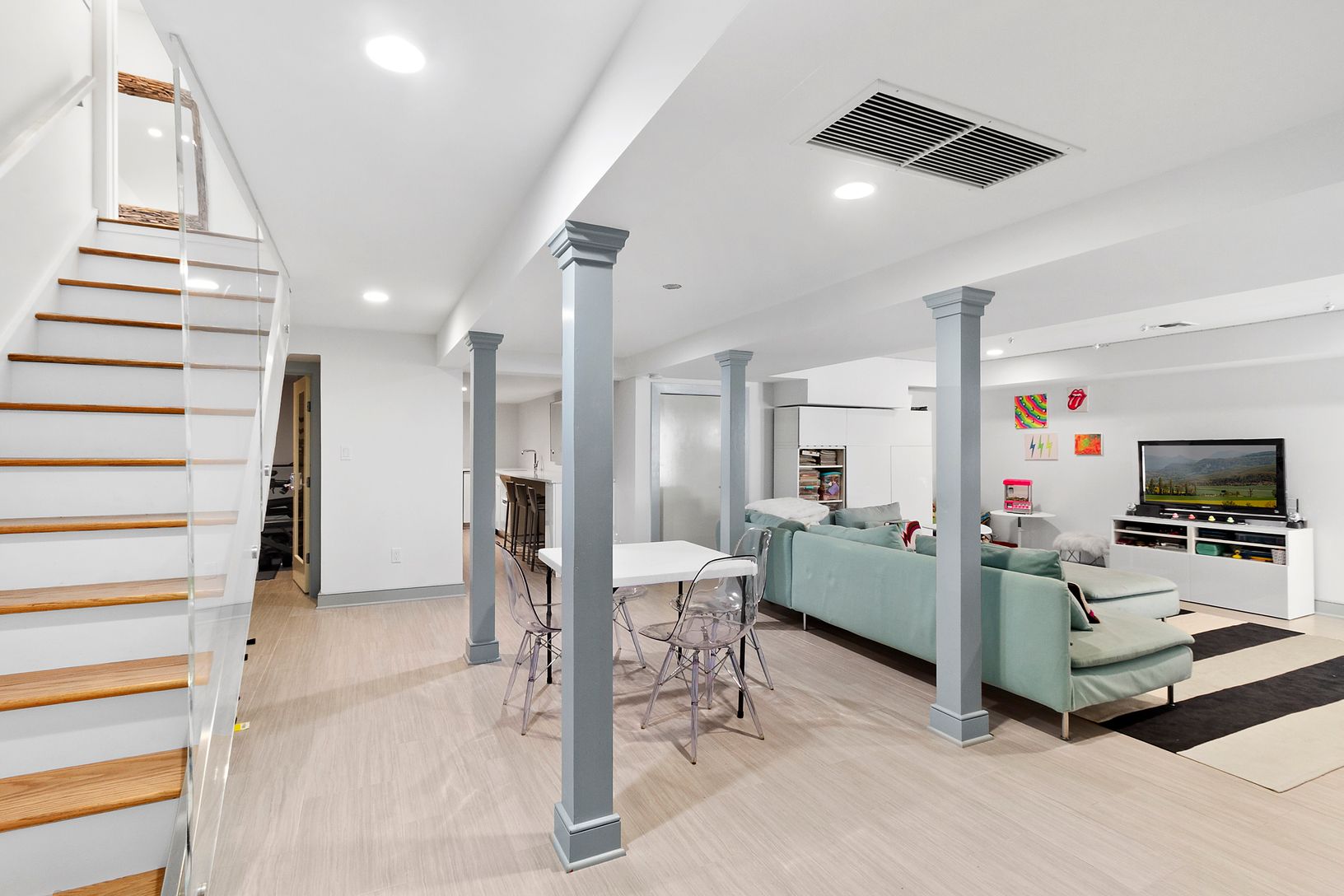 Finished lower level with gym, laundry, wet-bar beverage center, bath, office, walk out to pool area