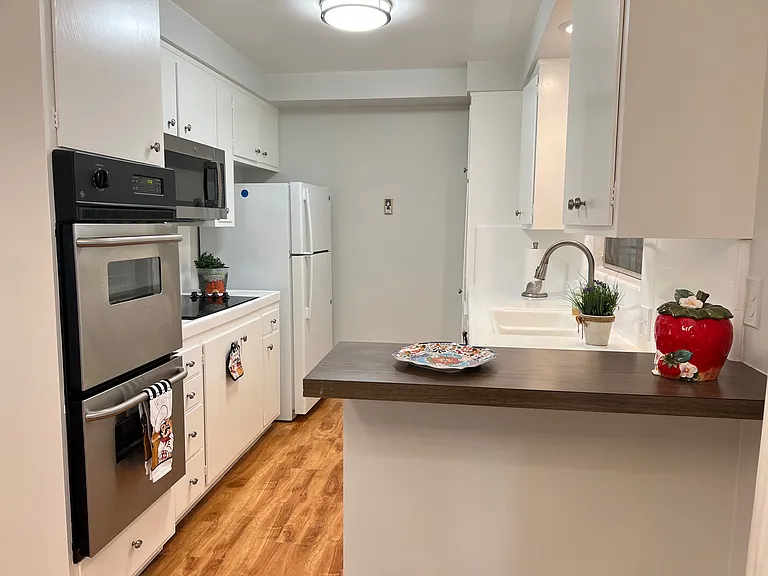 Kitchen with built-in appliances with newer double oven