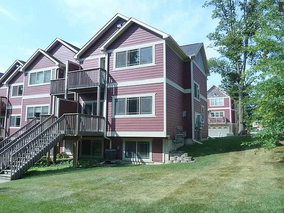 Back of house w/ deck and yard