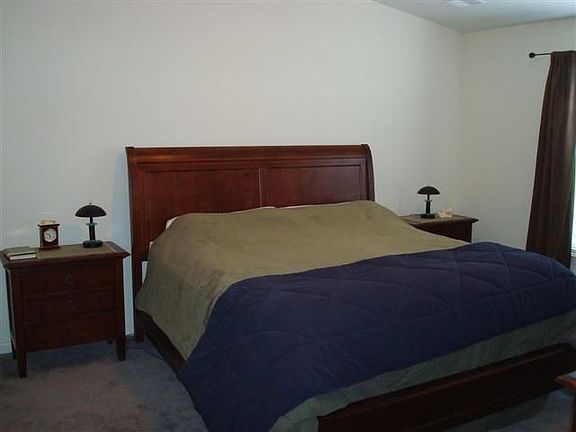 Master suite w/vaulted ceiling easily fits king size bed.