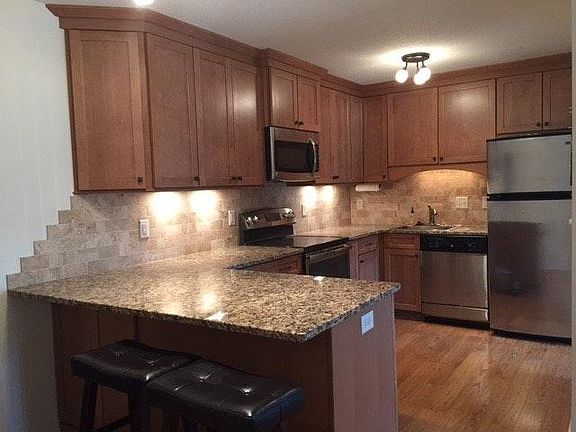 Newly updated kitchen with maple cabinets, granite counterto