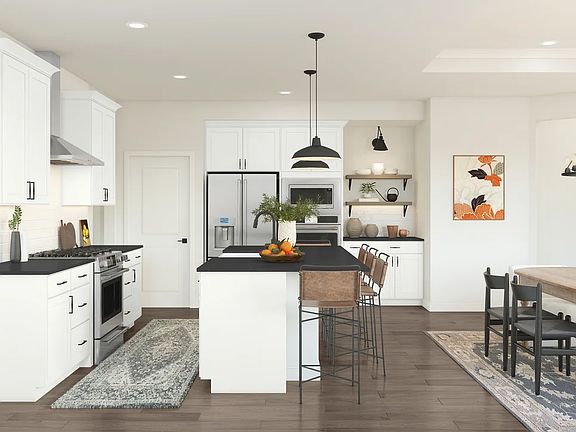 Kitchen with white cabinetry and floating shelves