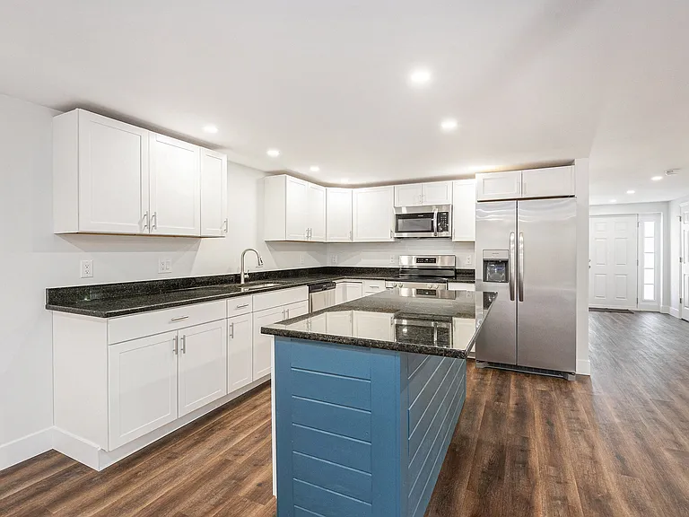 Kitchen with center island and brand new appliances