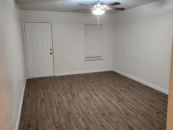 Large living room (17' x 12') with new 2" faux wood blinds.