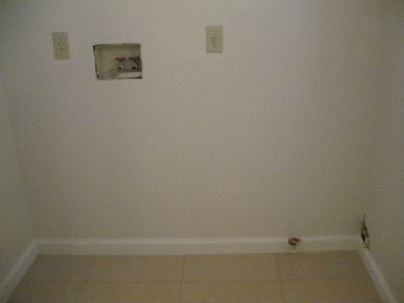 Laundry Room With Washer And Dryer Hook Up