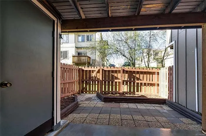 Walk-out patio with garden beds