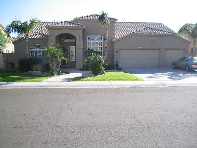 Front of house w/ custom landscaping