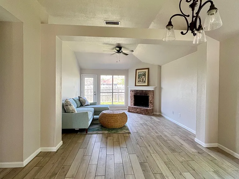 Spacious, open floor plan for living and dining. Wood-burning fireplace.