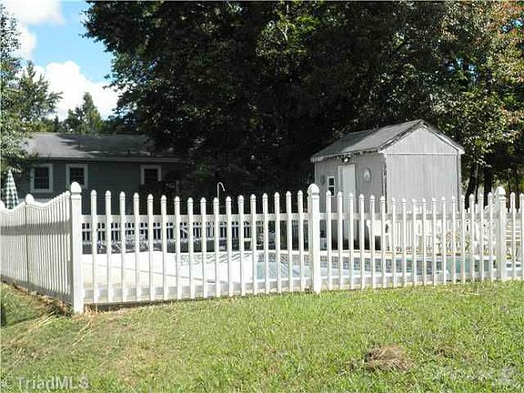 Inground Pool with White Picket Fence