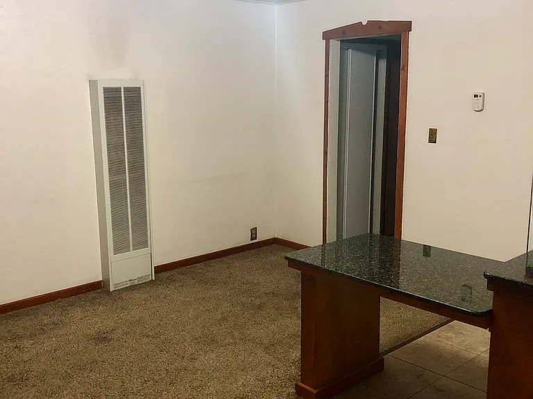 Large living area that is totally separate from kitchen with hallway separating to bedroom and bathroom in back. Great layout!