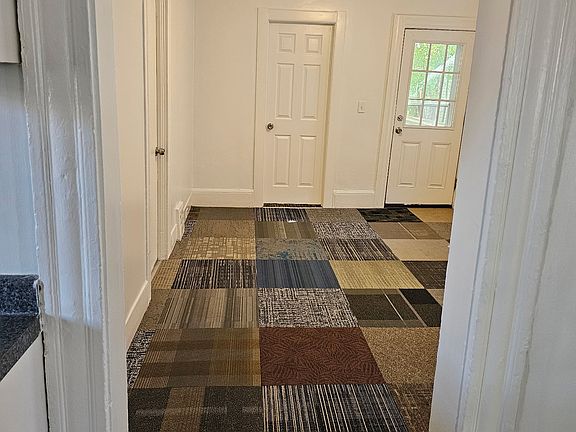 Living space view of master bedroom door and your front door.
