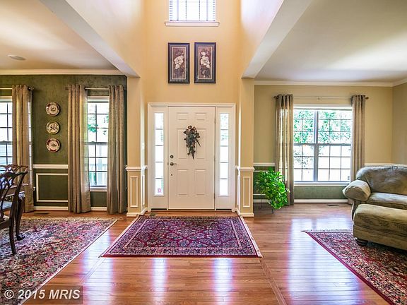 Two-Story Foyer with Gleaming Hardwoods