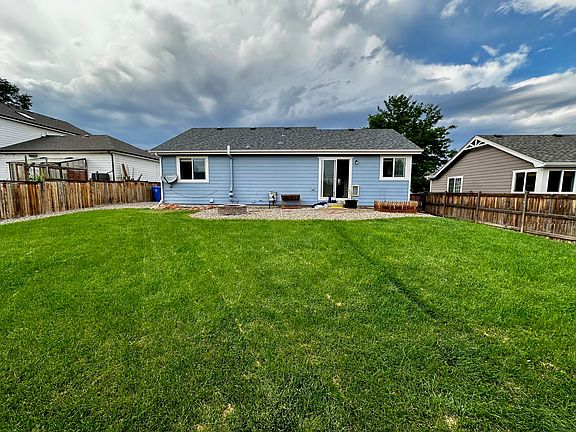 Large fenced back yard with sprinkler system