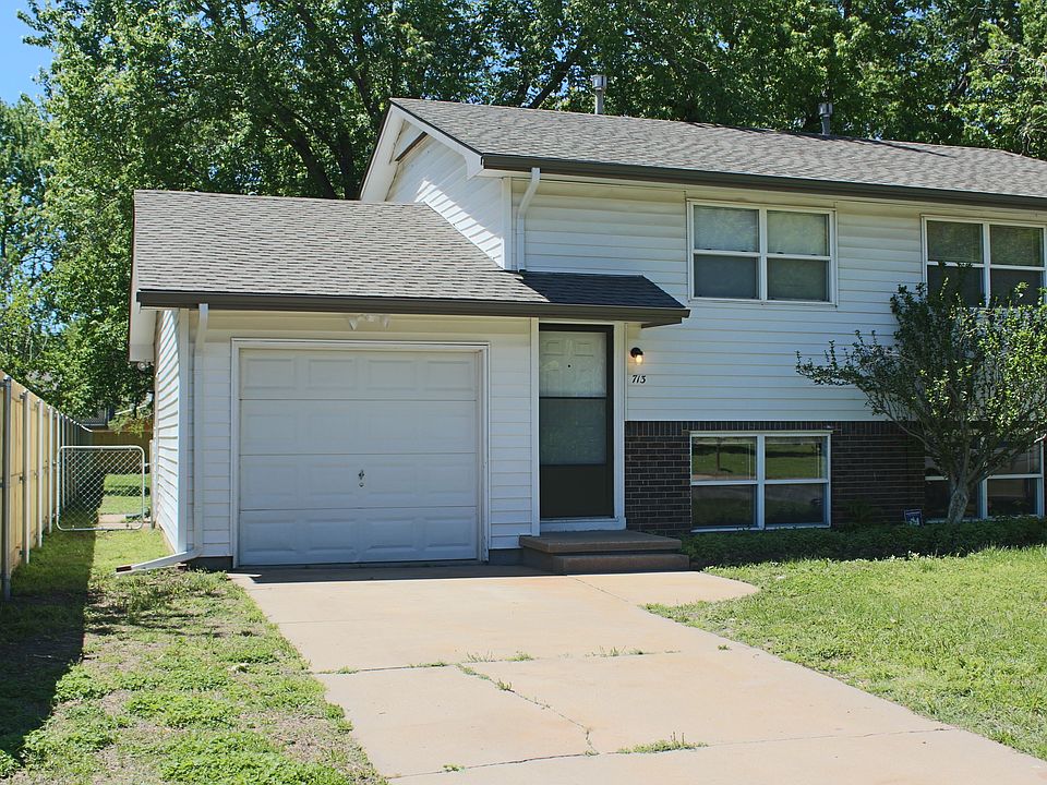 Exterior with Private Off-Street Parking and Attached Garage